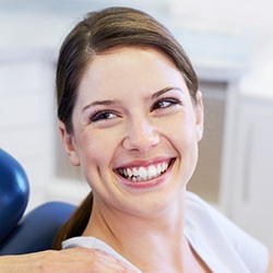 Woman in dental chair with healthy smile