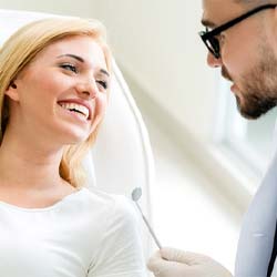 Woman listening to dentist