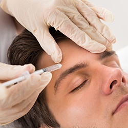 Closeup of man receiving Botox Therapeutic injection